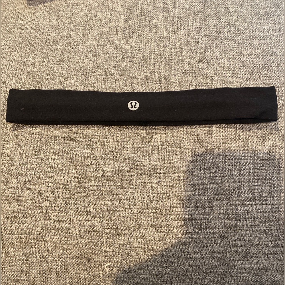 Two Lululemon fly away tamer headbands. Pink/coral and black.